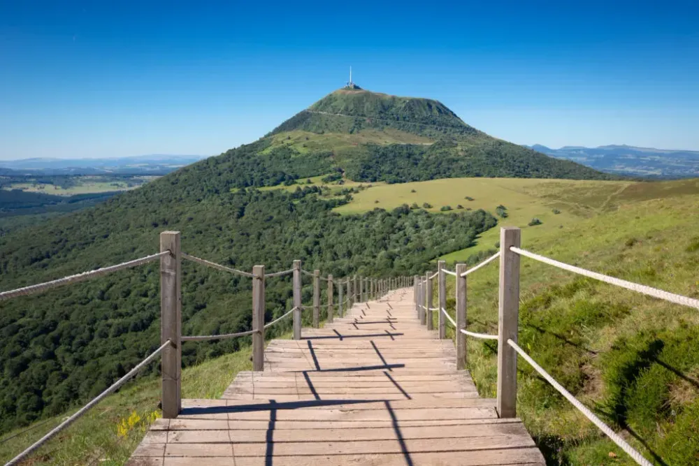 Wooden pathway leading toward Puy de DĂ´me, France